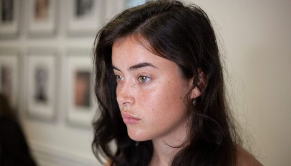 Blink Beauty Bar client with naturally defined eyebrows, highlighting personalized brow artistry and microblading results in Buffalo, NY.