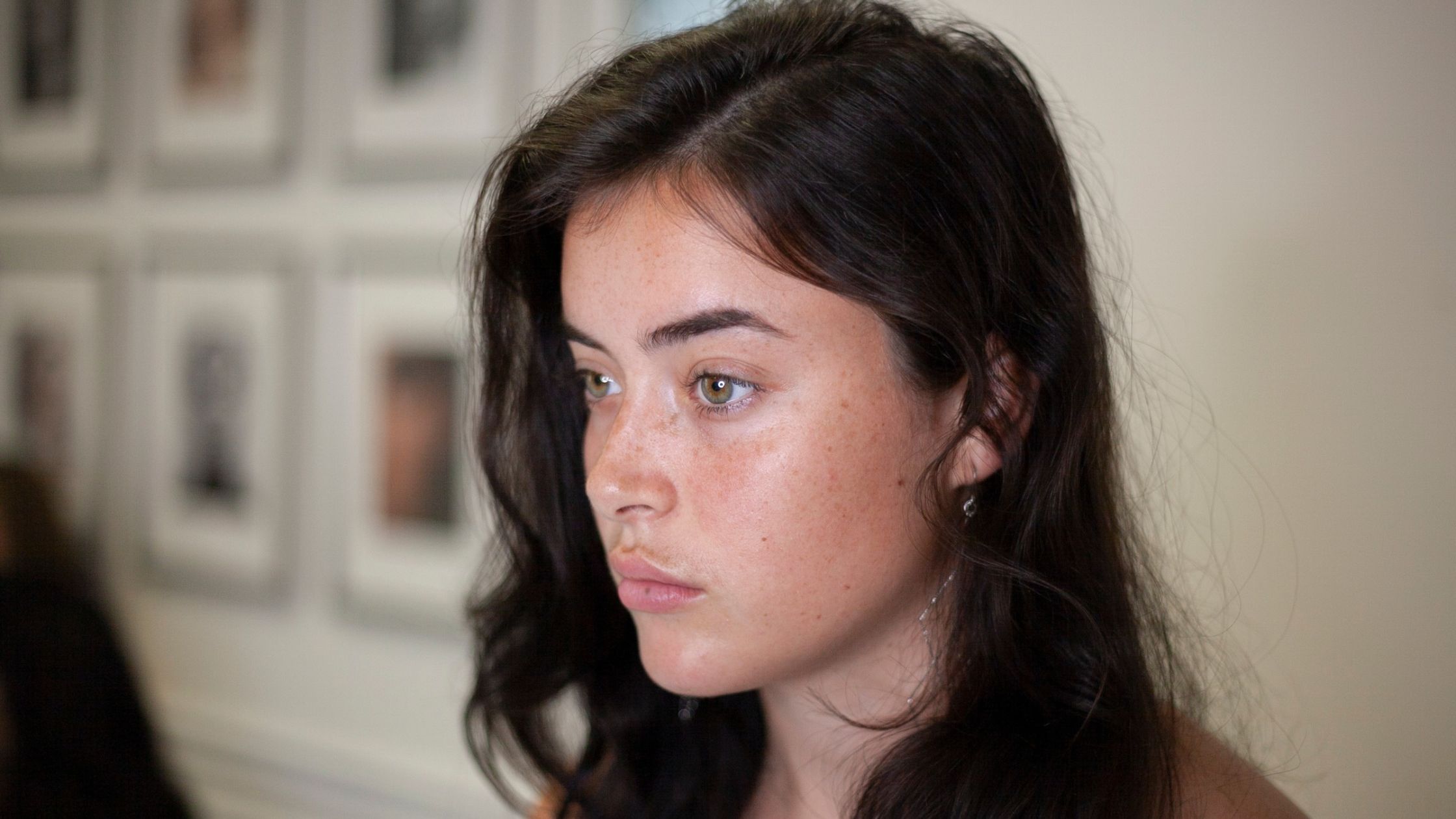 Blink Beauty Bar client with naturally defined eyebrows, highlighting personalized brow artistry and microblading results in Buffalo, NY.